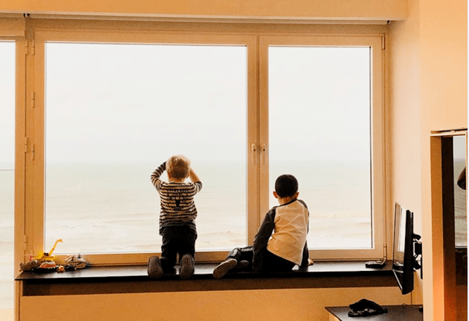 Two boys look at the sea