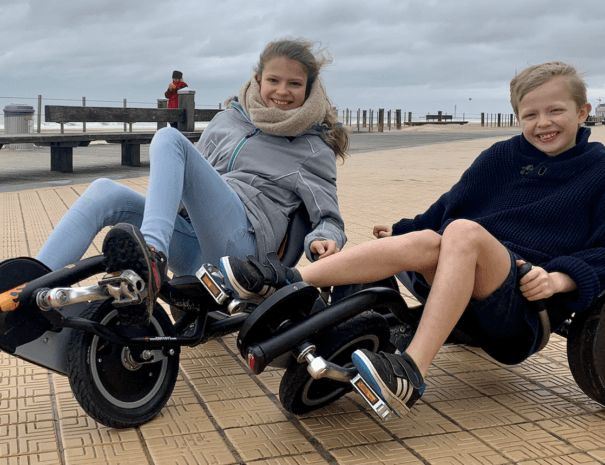 Girl and boy riding a go-kart Zeedijk Oostende